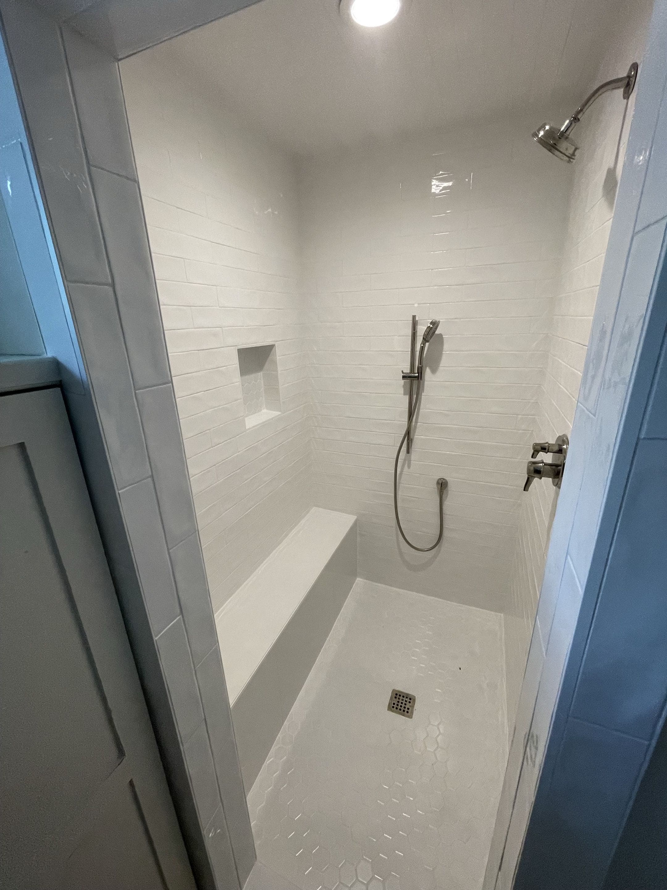 Bright white walk-in shower remodel