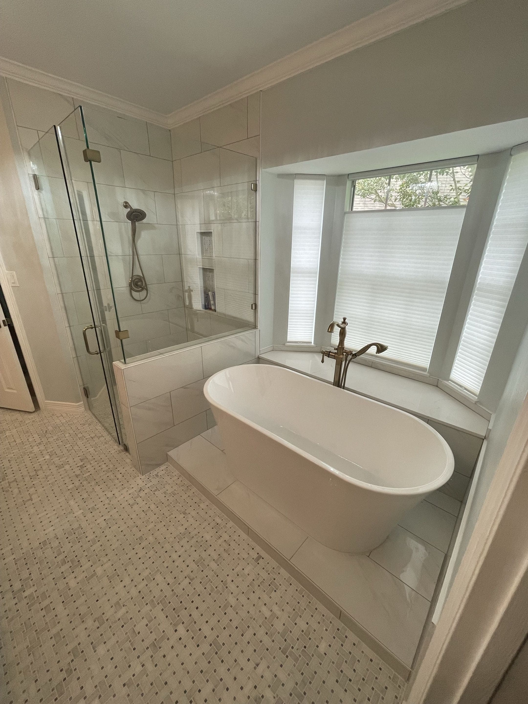 A finished freestanding-tub bathroom remodel in a Houston home